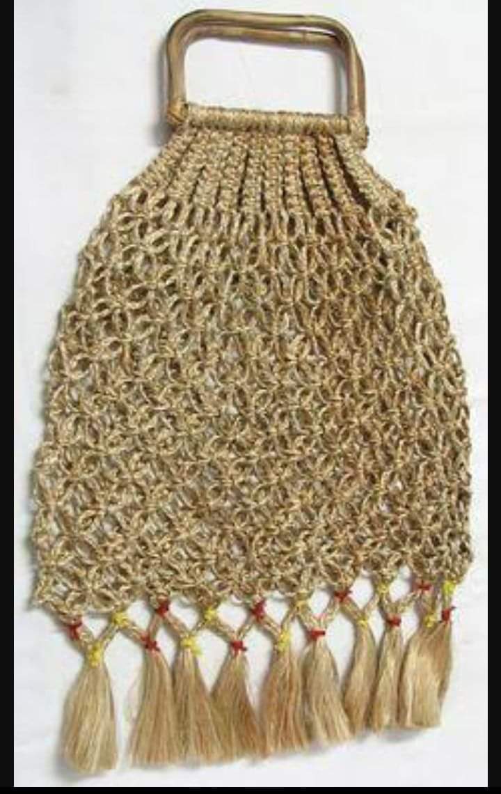 Macramé jute bag with a cane handle